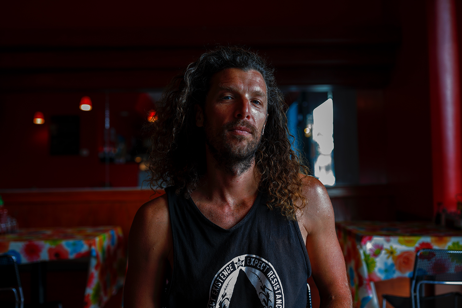 Photograph of protester protagonist Alexei Wood at a restaurant in Los Angeles California, 2019
